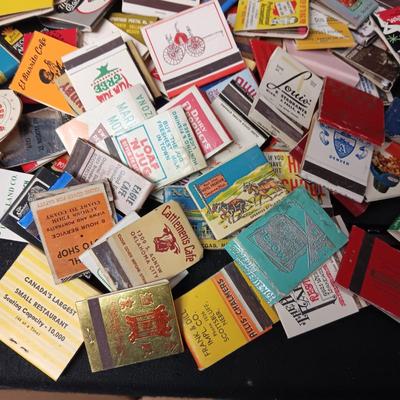 A COLLECTION OF MATCHBOOKS AND FAKE CIGARS