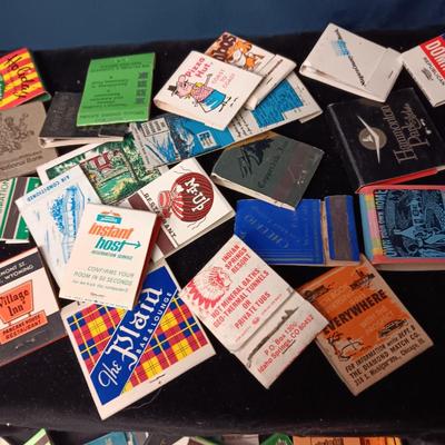 A COLLECTION OF MATCHBOOKS AND FAKE CIGARS
