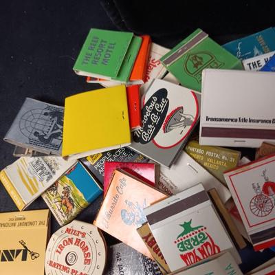 A COLLECTION OF MATCHBOOKS AND FAKE CIGARS