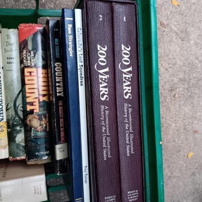 BOOKS AND A PLASTIC MILK CRRATE