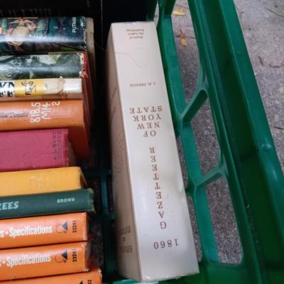 BOOKS AND A PLASTIC MILK CRRATE