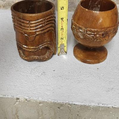 Sale Photo Thumbnail #400: Neat set of vintage steak knives and 4 vintage hand carved totem mugs.