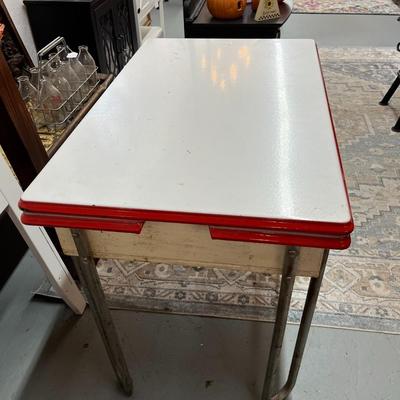 Sale Photo Thumbnail #799: Vintage Enamel Top Table with pull out leafs.  See photos for condition.