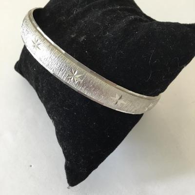 Monet Silver-tone starburst bangle bracelet