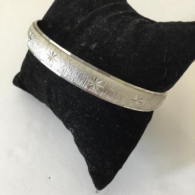 Monet Silver-tone starburst bangle bracelet