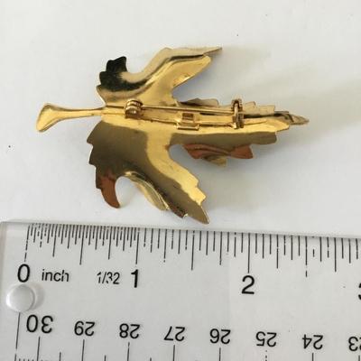 Maple leaf brooch, black and gold 1970s brooch