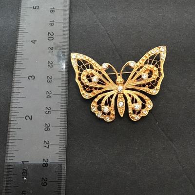 Gold tone, butterfly, lapel pin with rhinestones
