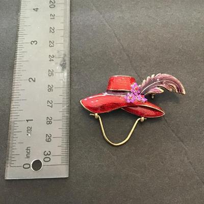 Red enamel hat lapel pin