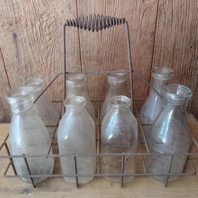 Set of Eight Vintage Dairy Milk Bottles Various Markings in Metal Wire Carry Caddy (#40)