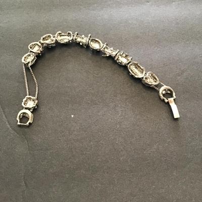 Sale Photo Thumbnail #128: Silvertone bracelet with multicolored rhinestones. Please see attached photos.