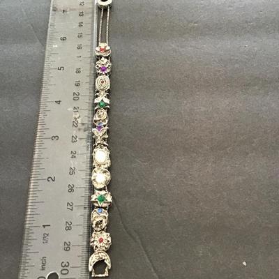 Sale Photo Thumbnail #127: Silvertone bracelet with multicolored rhinestones. Please see attached photos.