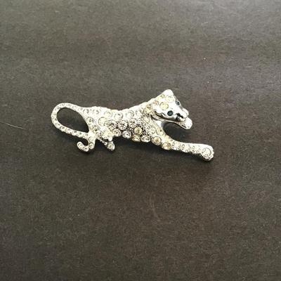 Sale Photo Thumbnail #149: Silvertone panther lapel pin with rhinestones. Please see attached photos.