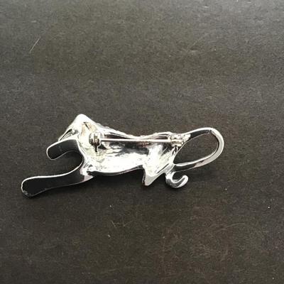Sale Photo Thumbnail #151: Silvertone panther lapel pin with rhinestones. Please see attached photos.