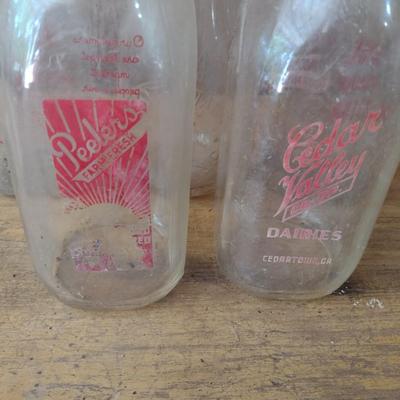 Set of Four Vintage Painted Logo One Quart Dairy Milk Bottles Peeler, Cedar Valley, Guilford, Highs Quality Milk (#50)