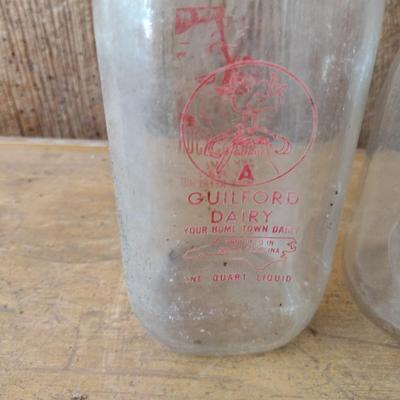 Set of Four Vintage Painted Logo One Quart Dairy Milk Bottles Peeler, Cedar Valley, Guilford, Highs Quality Milk (#50)