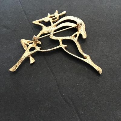 Sale Photo Thumbnail #191: Gold tone, Christmas reindeer. Please see attached photos.