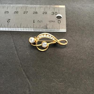 Sale Photo Thumbnail #199: Colton lapel pin with rhinestones. Please see attached photos.
