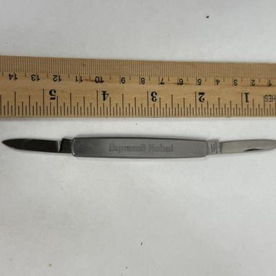Sale Photo Thumbnail #63: 2 folding blades.  Marked "Dynabil Nobel" on one side and "Airguns RWS Pellets" on the other. Stainless steel blades, made in Japan.