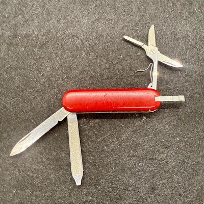 Sale Photo Thumbnail #5: Tools include knife blade, nail file, scissors and pull-out toothpick.  Very good used condition.