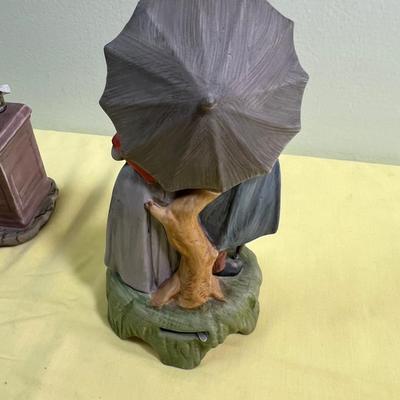 2 Porcelain Bisque Figurines; Stock Broker and Old Man & Woman w/Umbrella. 