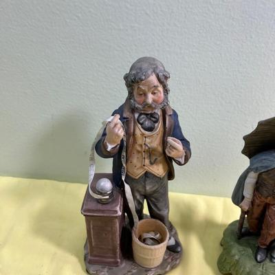 2 Porcelain Bisque Figurines; Stock Broker and Old Man & Woman w/Umbrella. 