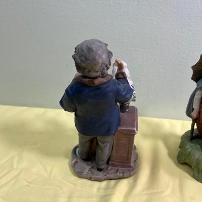2 Porcelain Bisque Figurines; Stock Broker and Old Man & Woman w/Umbrella. 