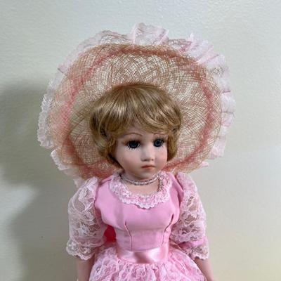Porcelain Doll Named BEBE W/Stand  (Pink) 