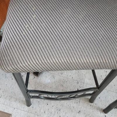 Sale Photo Thumbnail #477: Pair of metal bars stool in great shape. One has a bit of staining in the seat but not super noticable.