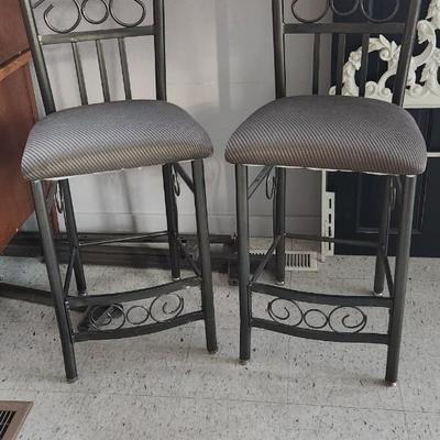 Sale Photo Thumbnail #476: Pair of metal bars stool in great shape. One has a bit of staining in the seat but not super noticable.