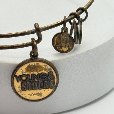 LOT 90J: Alex and Ani Charm Bracelets: Capricorn, Young & Strong, Paw Print & More