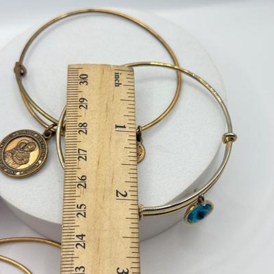 LOT 90J: Alex and Ani Charm Bracelets: Capricorn, Young & Strong, Paw Print & More