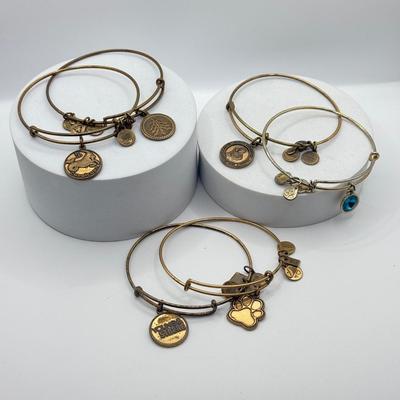 LOT 90J: Alex and Ani Charm Bracelets: Capricorn, Young & Strong, Paw Print & More