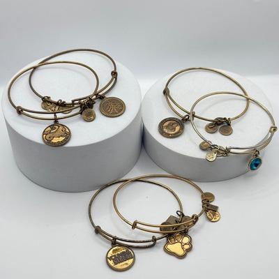 LOT 90J: Alex and Ani Charm Bracelets: Capricorn, Young & Strong, Paw Print & More