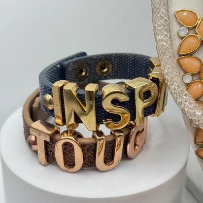 LOT 100J: "TOUGH" & "INSPIRE" Bracelets, Necklaces & More