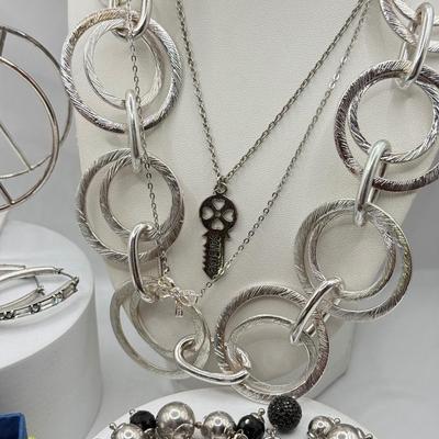 LOT 121J: Silvertone Jewelry - Peace Sign Hoops, Necklaces & More