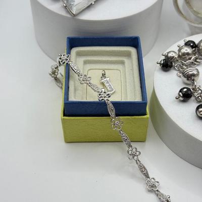 LOT 121J: Silvertone Jewelry - Peace Sign Hoops, Necklaces & More