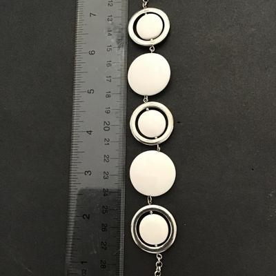 Silvertone white plastic disc fashion bracelet