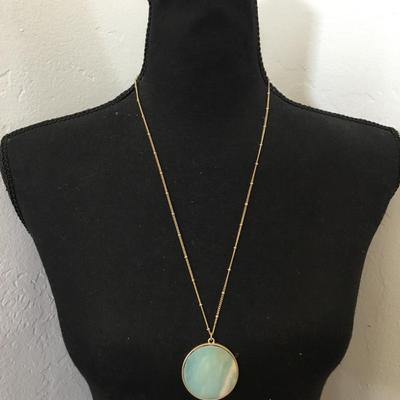 Beautiful satin, gold tone, stone circular pendant necklace