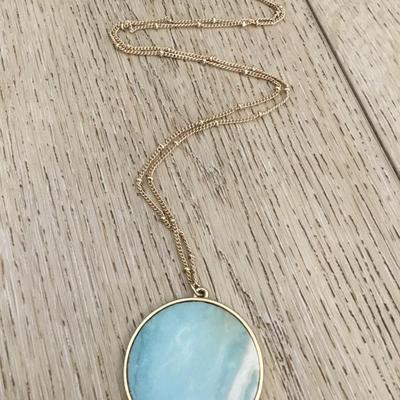 Beautiful satin, gold tone, stone circular pendant necklace