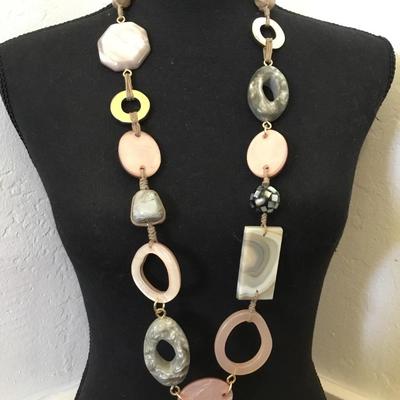 Beautiful stone and shell and acrylic. Beaded statement necklace. Very nice quality,