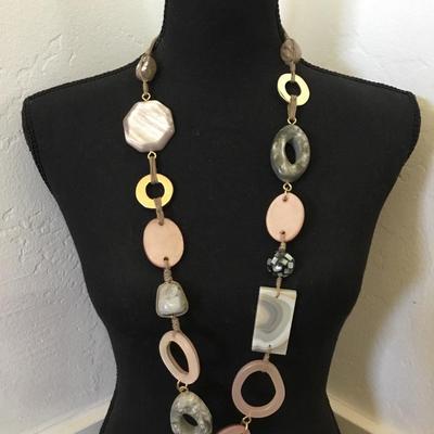 Beautiful stone and shell and acrylic. Beaded statement necklace. Very nice quality,