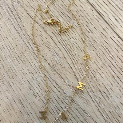 Dainty gold, toned mama necklace