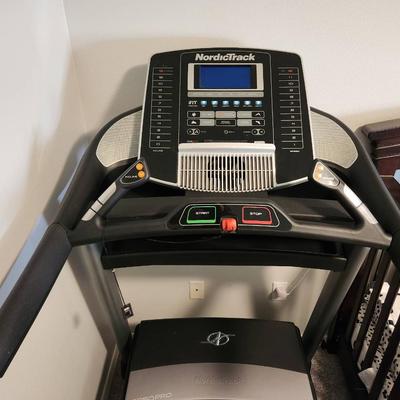 Sale Photo Thumbnail #11: NordicTrack C 950 Pro treadmill featuring a digital display with iFit compatibility. Includes speed and incline controls, multiple workout modes, and handgrip heart rate sensors. Designed with a durable belt and sturdy frame, suitable for home exercise. E