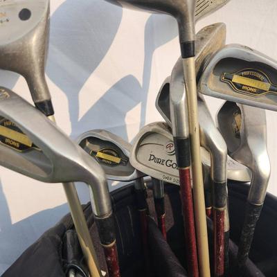 Sale Photo Thumbnail #23: Lynx golf bag containing a variety of golf clubs, including drivers and irons. Brands include Satellite (MX-Plus 3), Dunlop Gold, and others. The bag features a multi-compartment design with zippered pockets and an adjustable strap for portability. The cl