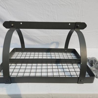Sale Photo Thumbnail #34: Wall-mounted metal rack with a durable black finish featuring two tiers of grid shelving and an arched design. Includes four hooks at the lower edge for added utility. Suitable for organizing kitchen, bathroom, or workspace items. Comes with assembly hard