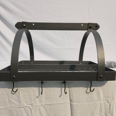 Sale Photo Thumbnail #36: Wall-mounted metal rack with a durable black finish featuring two tiers of grid shelving and an arched design. Includes four hooks at the lower edge for added utility. Suitable for organizing kitchen, bathroom, or workspace items. Comes with assembly hard