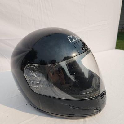 Sale Photo Thumbnail #37: HJC black full-face motorcycle helmet featuring a clear visor and internal padded lining. The helmet is DOT certified, indicating it meets safety standards for motorcycles. The outer shell shows light wear. Size and specific model details are not specifie