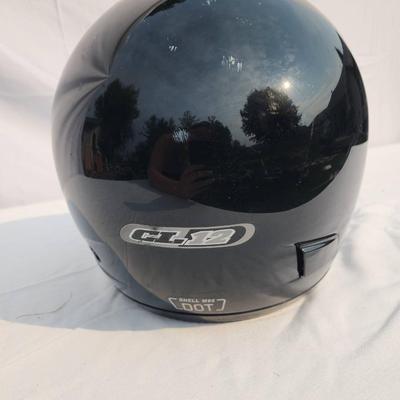 Sale Photo Thumbnail #39: HJC black full-face motorcycle helmet featuring a clear visor and internal padded lining. The helmet is DOT certified, indicating it meets safety standards for motorcycles. The outer shell shows light wear. Size and specific model details are not specifie