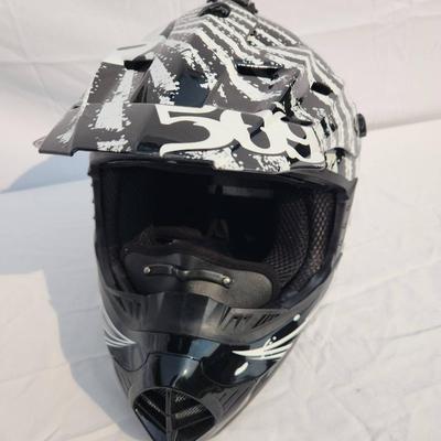 Sale Photo Thumbnail #45: 509 full-face off-road helmet featuring a bold black and white graphic design. Includes an adjustable visor, vented front for breathability, soft interior padding for comfort, and secure chin strap. Designed for off-road terrains and durable protection. S