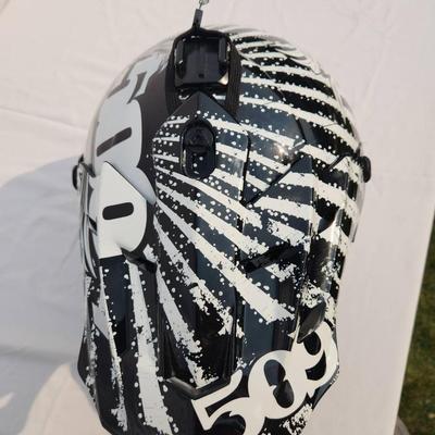 Sale Photo Thumbnail #48: 509 full-face off-road helmet featuring a bold black and white graphic design. Includes an adjustable visor, vented front for breathability, soft interior padding for comfort, and secure chin strap. Designed for off-road terrains and durable protection. S